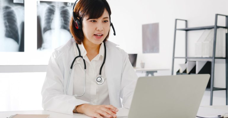 Young Asia female doctor in white medical uniform with stethosco