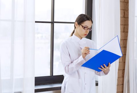 Young doctor preparing the registration file