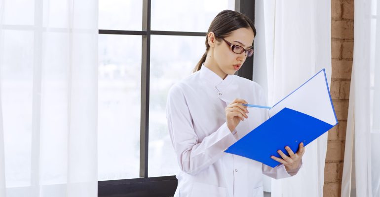 Young doctor preparing the registration file